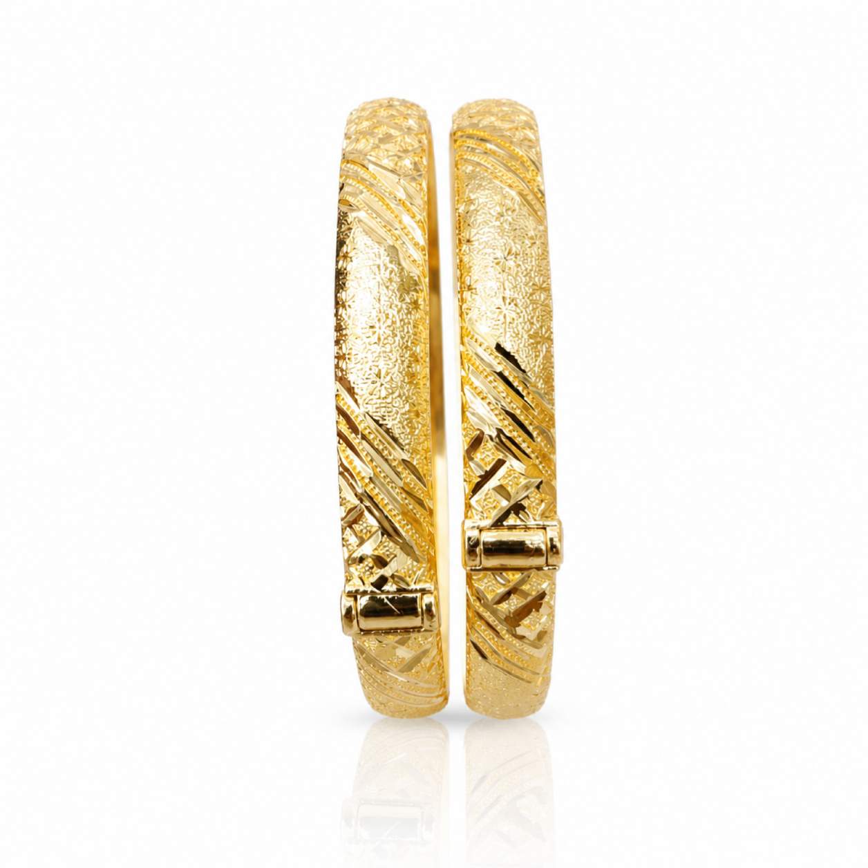 Twisted Leaf Openwork Pair - wide twisted bangles with ribbed and honeycomb spiral panels